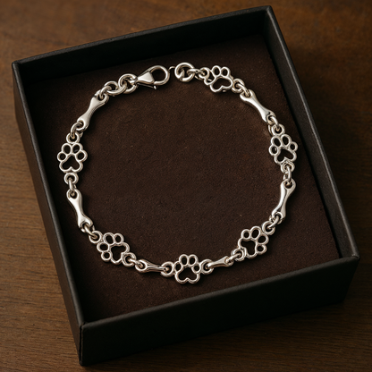 Pulsera de plata con dije de pata de perro y hueso